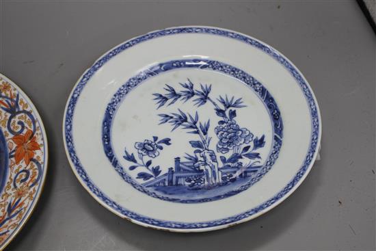 A Chinese Imari plate decorated with flowers in an urn, 25cm and a blue and white plate, 23cm